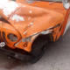 Image for article titled Man Crashes Flimsy Postal Jeep And Somehow Avoids Instant Death